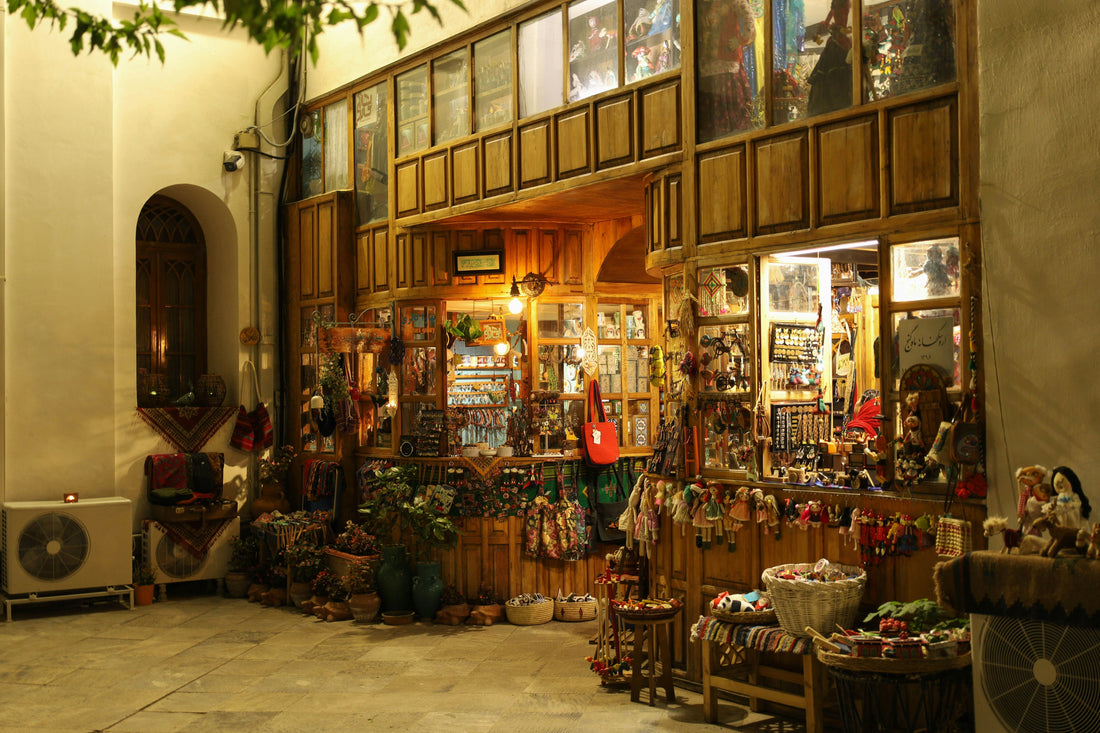 Warmly lit museum gift shop with wooden display shelves