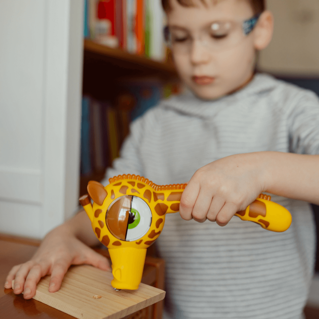 Child holding Handy Famm STEM Starter Hammer, ready for DIY activity